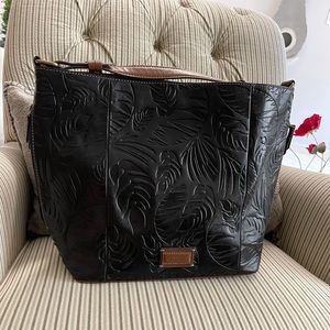 TIGNANELLO designer handbag. NWOT. Tooled black leather. Fully line w/pockets.
